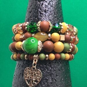 Multicolor Four Separate Beaded Bracelets one with Heart Charm